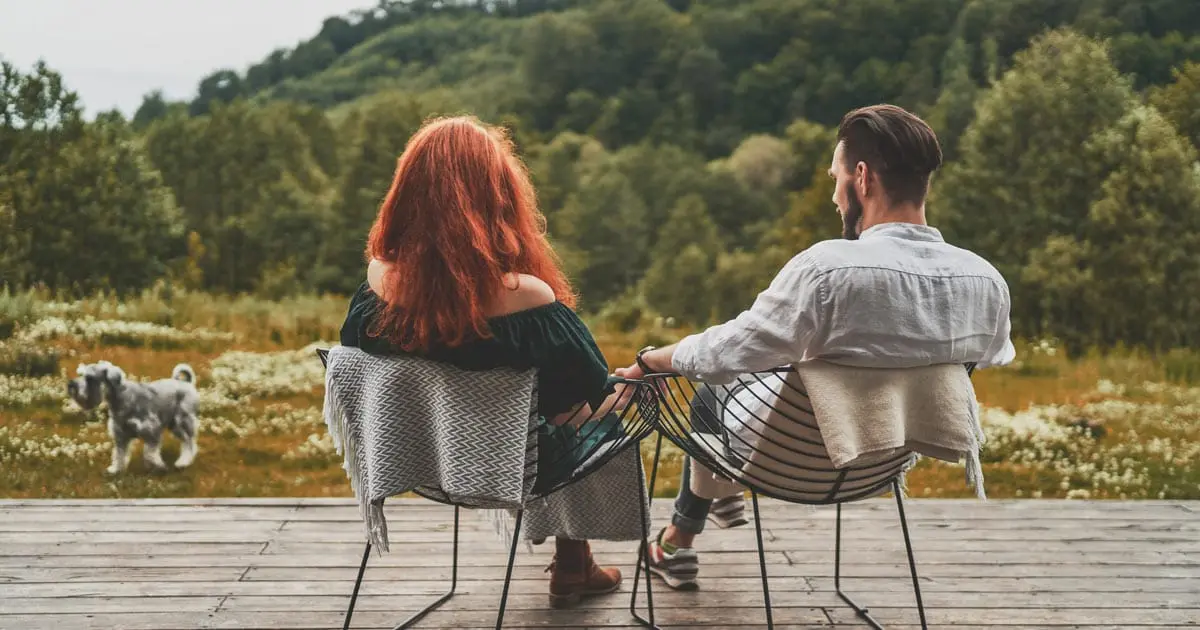 couple enjoying view from home in the countryside